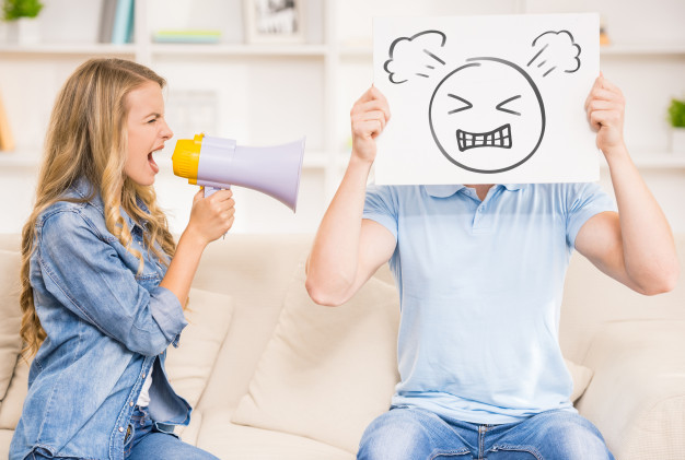 wife-shouting-her-husband-with-mouthpiece_85574-5373.jpg